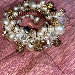 Really cute pearl and gold and crystals through it on a watch band bracelet